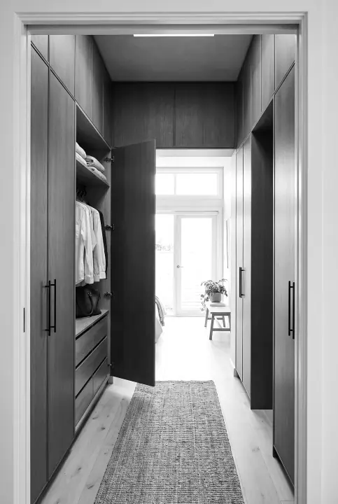 Design concept: wall of floor-to-ceiling hinged wardrobes in bronzed oak (black and white)