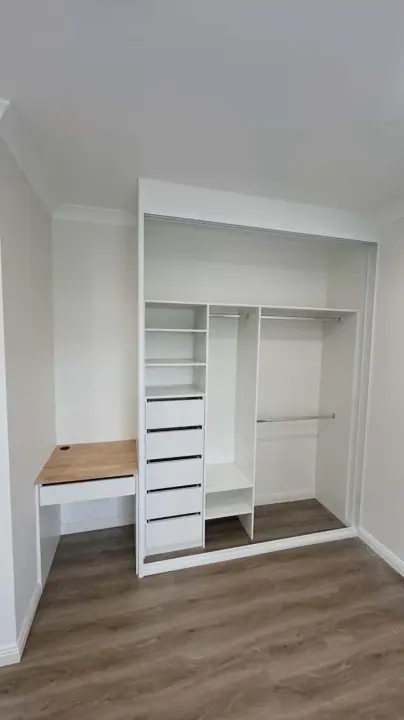 Sliding wardrobe with a timber desk built into the opening