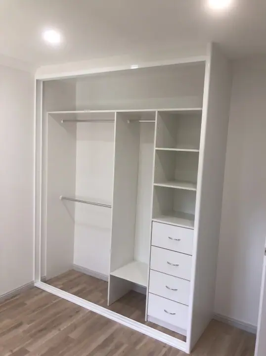 Two-door wardrobe internals with shelving, hanging and drawers