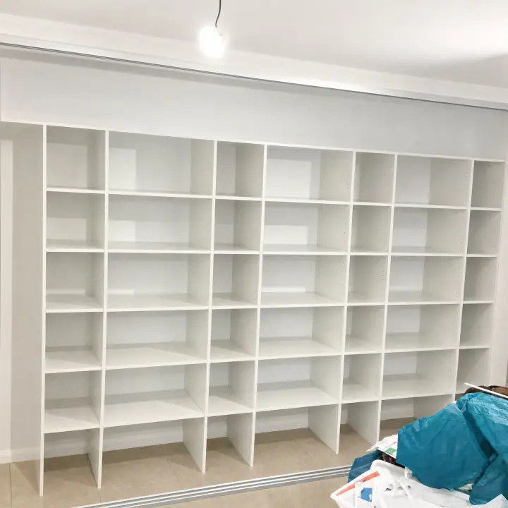 Pigeon-hole shelving wall built inside a wardrobe