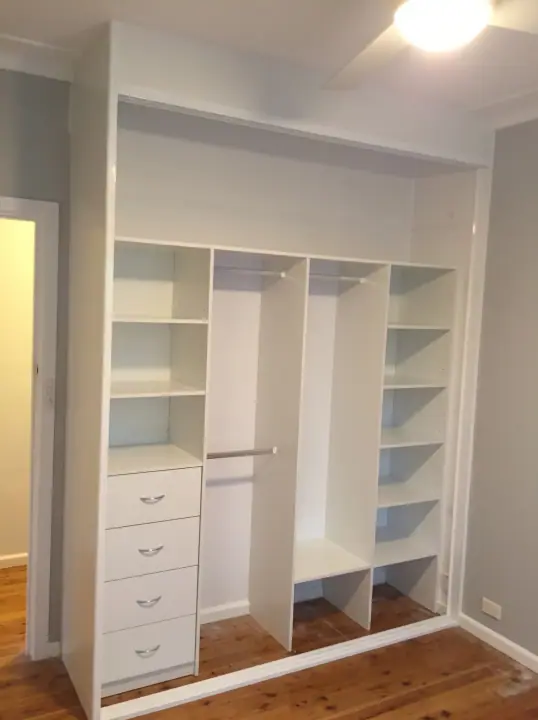 Reach-in wardrobe internals with a drawer tower