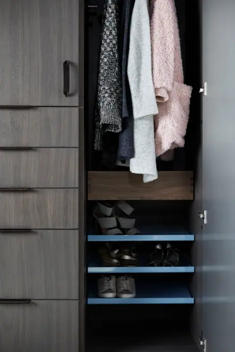 Wardrobe bay with a drawer bank below and open shelving above