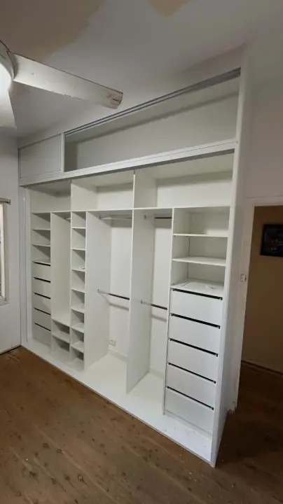 Wardrobe internals with overhead cupboards, hanging, shelves and drawers