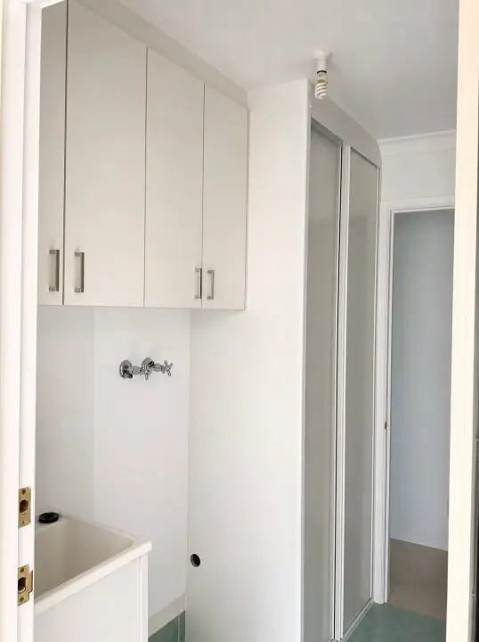 Laundry cupboards with matching sliding doors