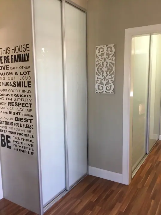Pantry with white glass sliding doors