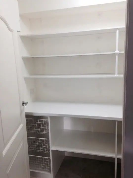 Pantry shelving with a wire basket and bench