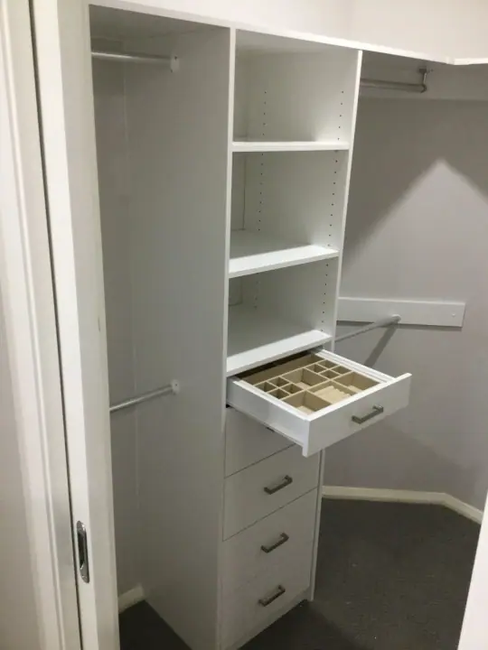 Walk-in wardrobe with a pull-out jewellery drawer