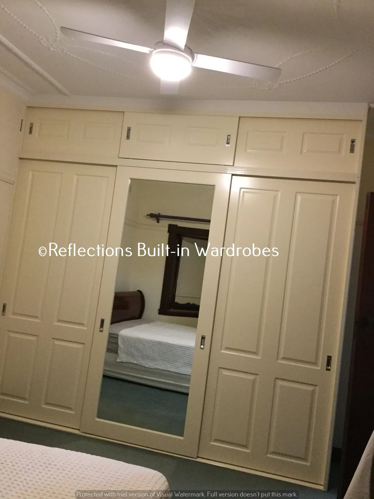 Custom sliding wardrobe made to the full width and height of a bedroom recess