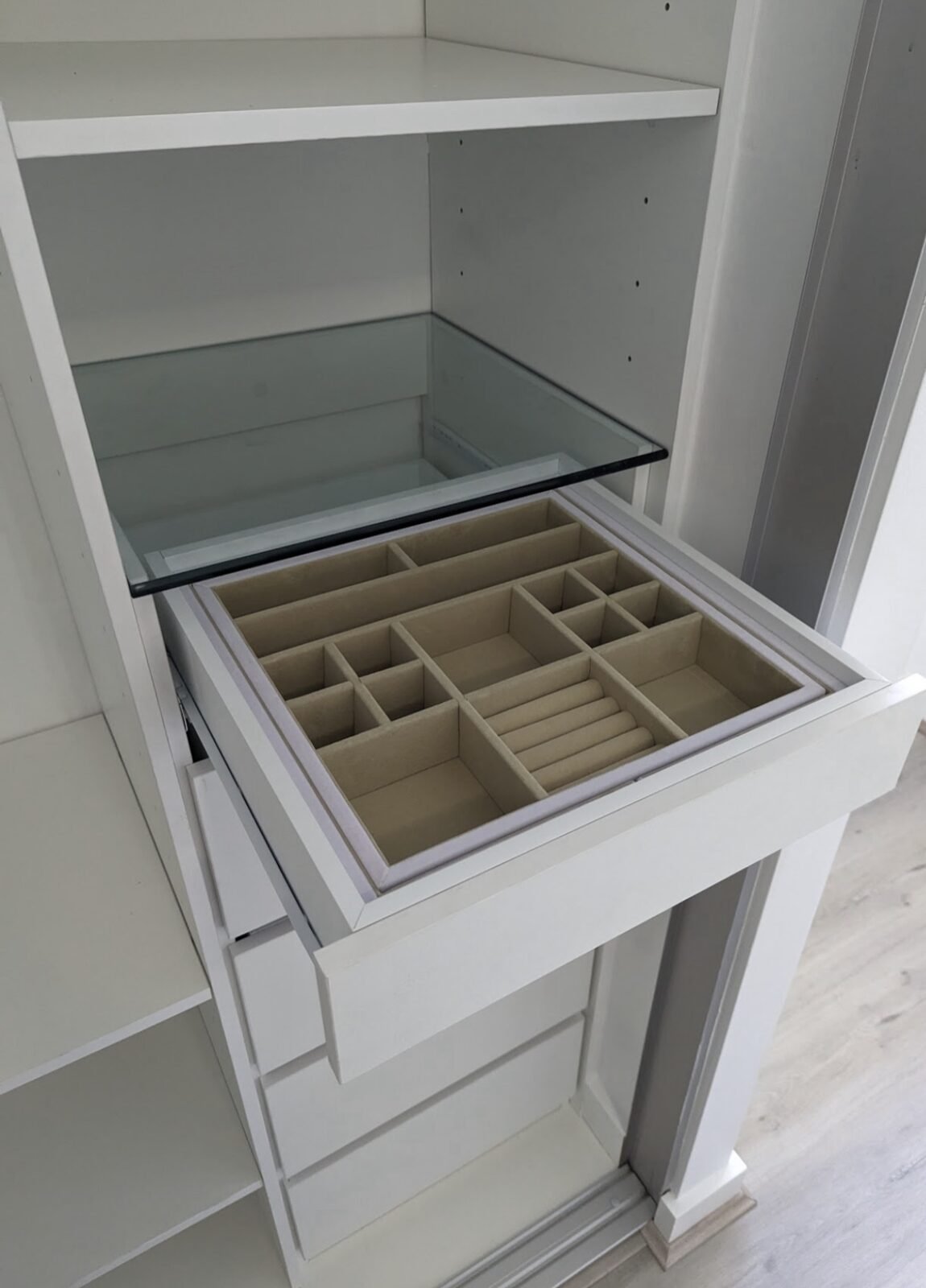 Pull-out jewellery drawer with glass top and felt-lined compartments