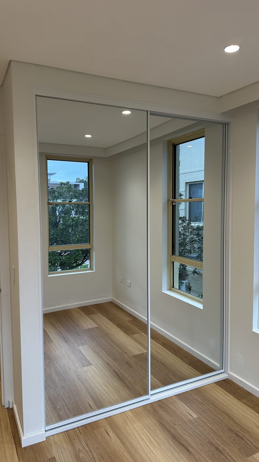 Modern bedroom with custom built-in wardrobe
